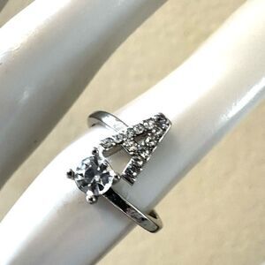A monogram rhinestone ring